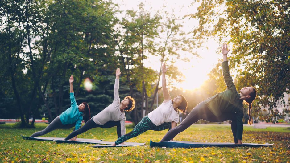 Students holding a pose together in the morning light.